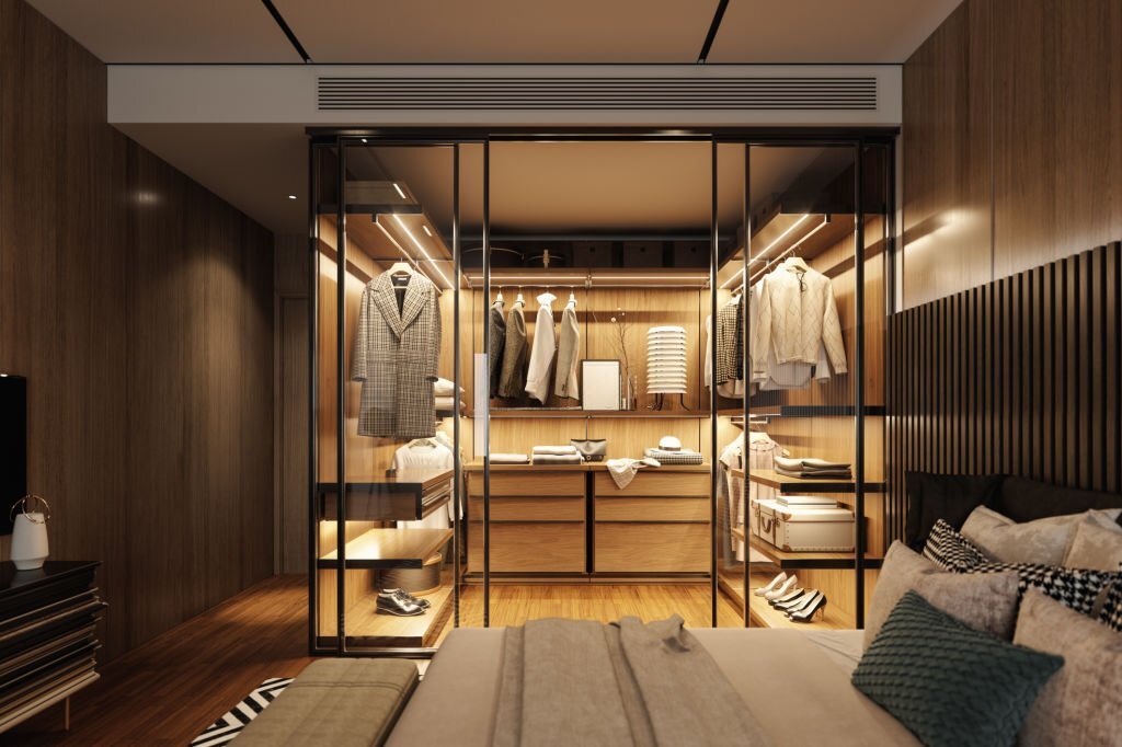 Interior of an empty luxury bedroom with walk-in closet.